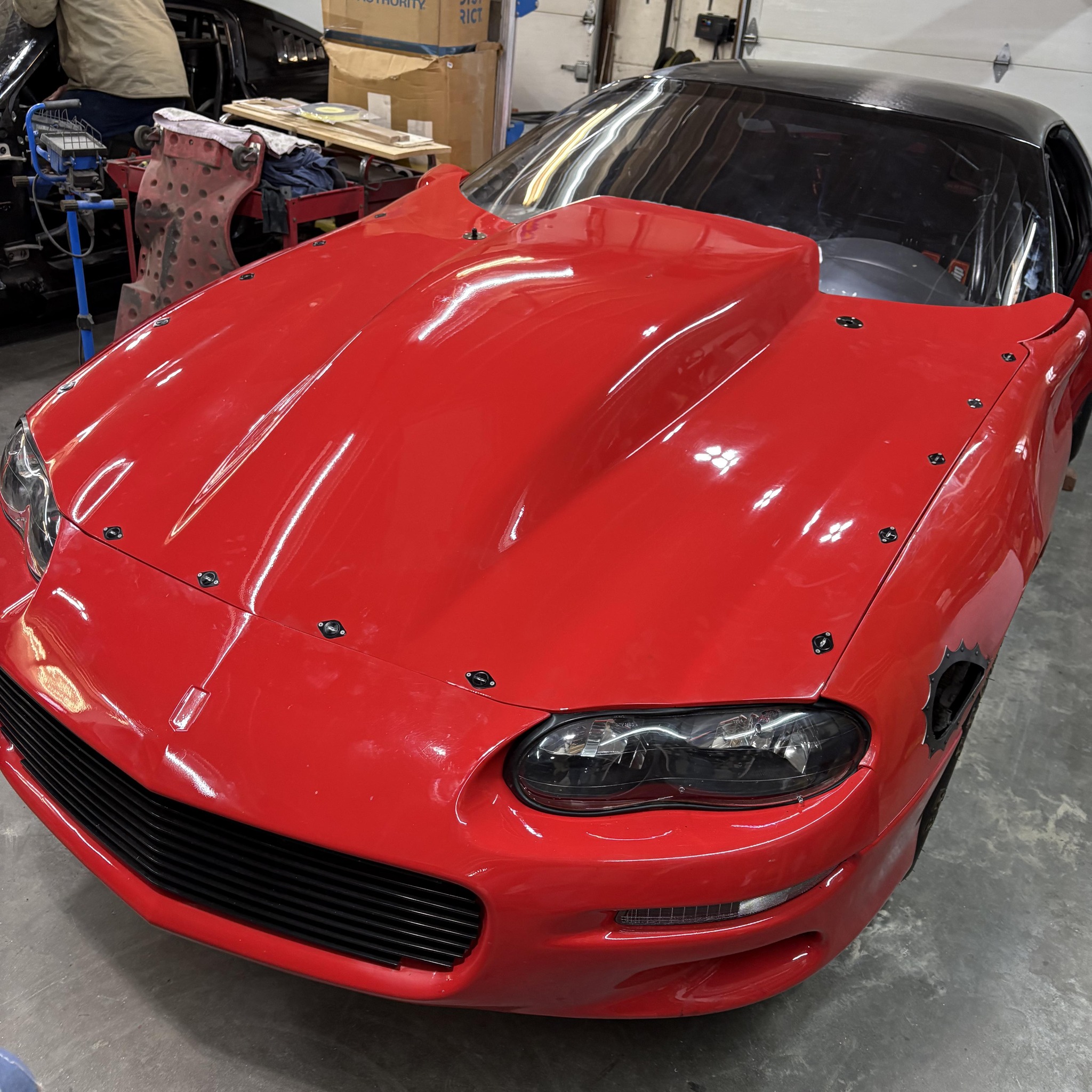 Red Camaro race car inside the Foulks Performance shop